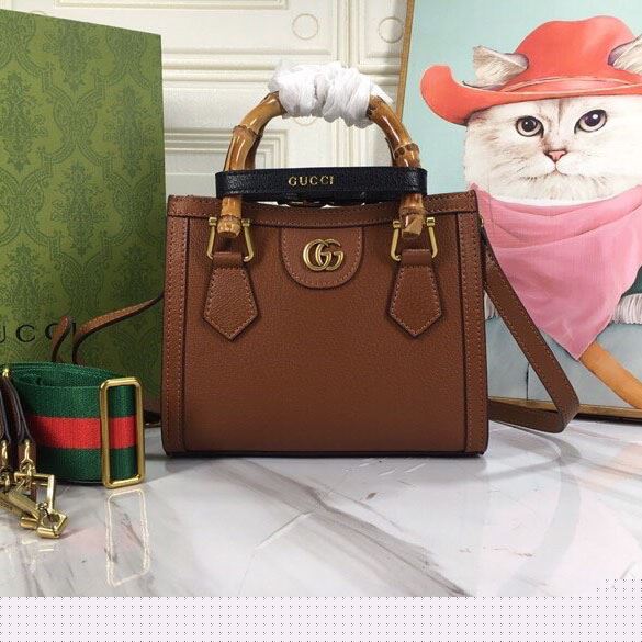 G*u*i top handle bags